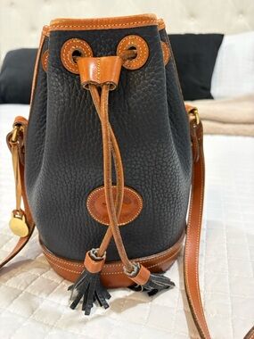 Dooney & Bourke Black Pebble Leather Mini Drawstring Bag with Tan Trim